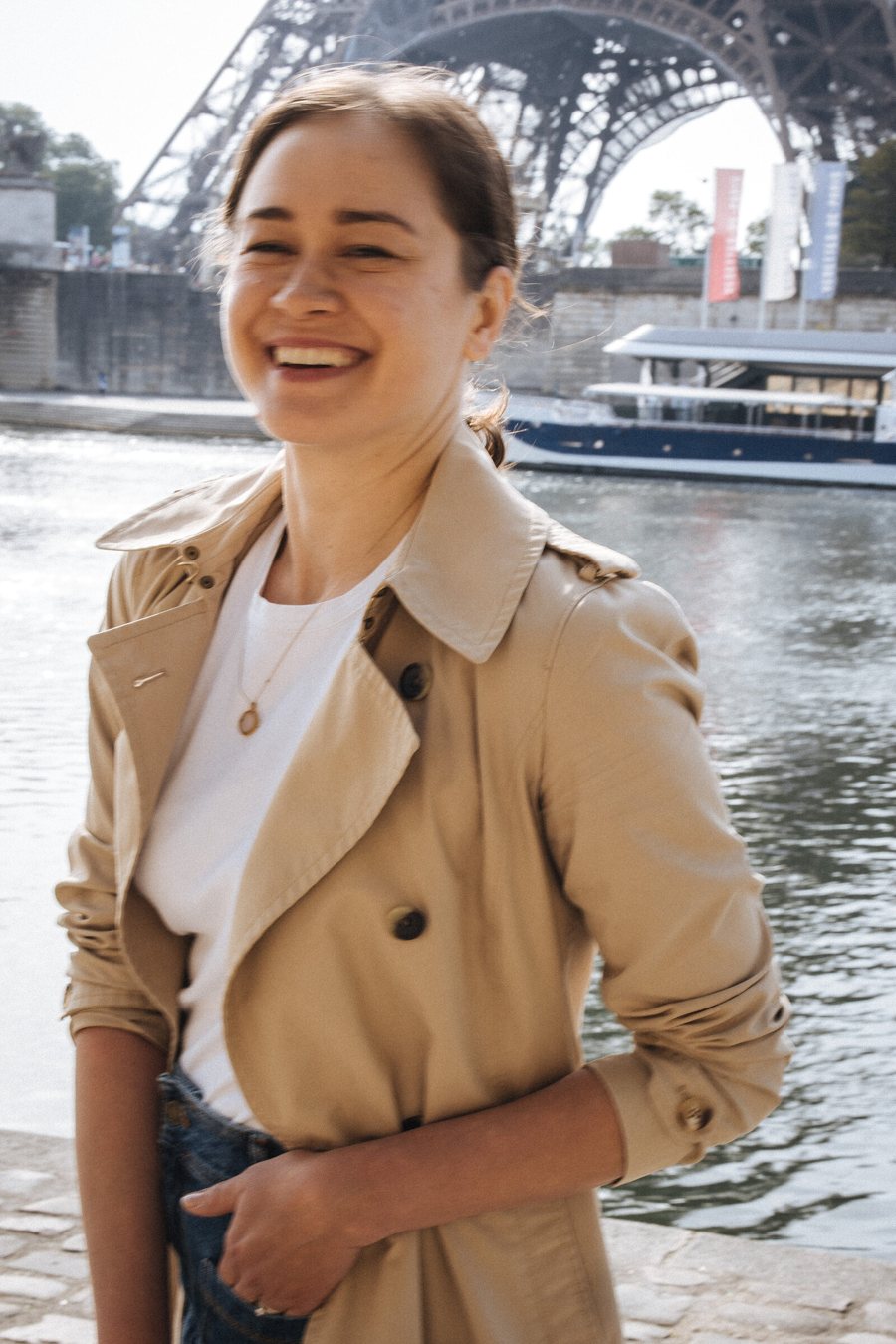 Aliya smiling by the Seine in Paris